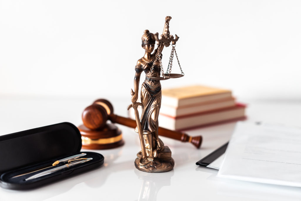 Photograph of the Blind Lady Justice on a Paralegal Law Firm desk.