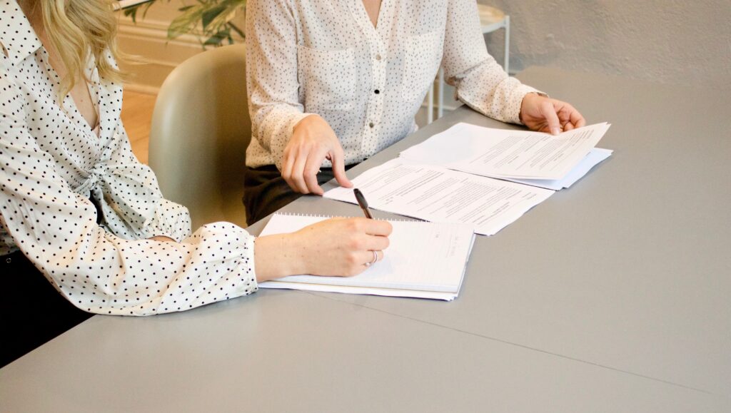 An influencer signing an influencer agreement