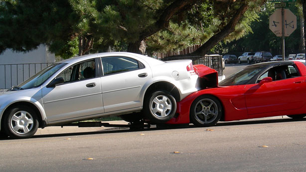 Red Corvette crashed into a Chrysler Sebring